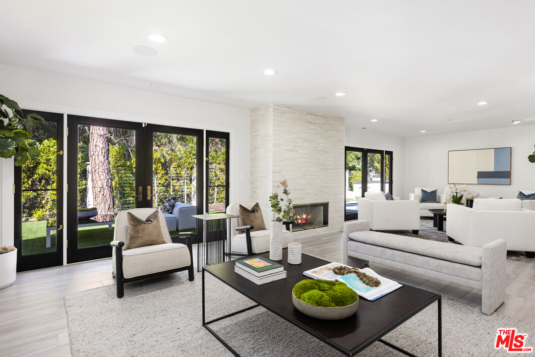 16167 Meadowcrest Road Sherman Oaks, CA 91403 - Photo 14 of 31 a living room with furniture and a large window