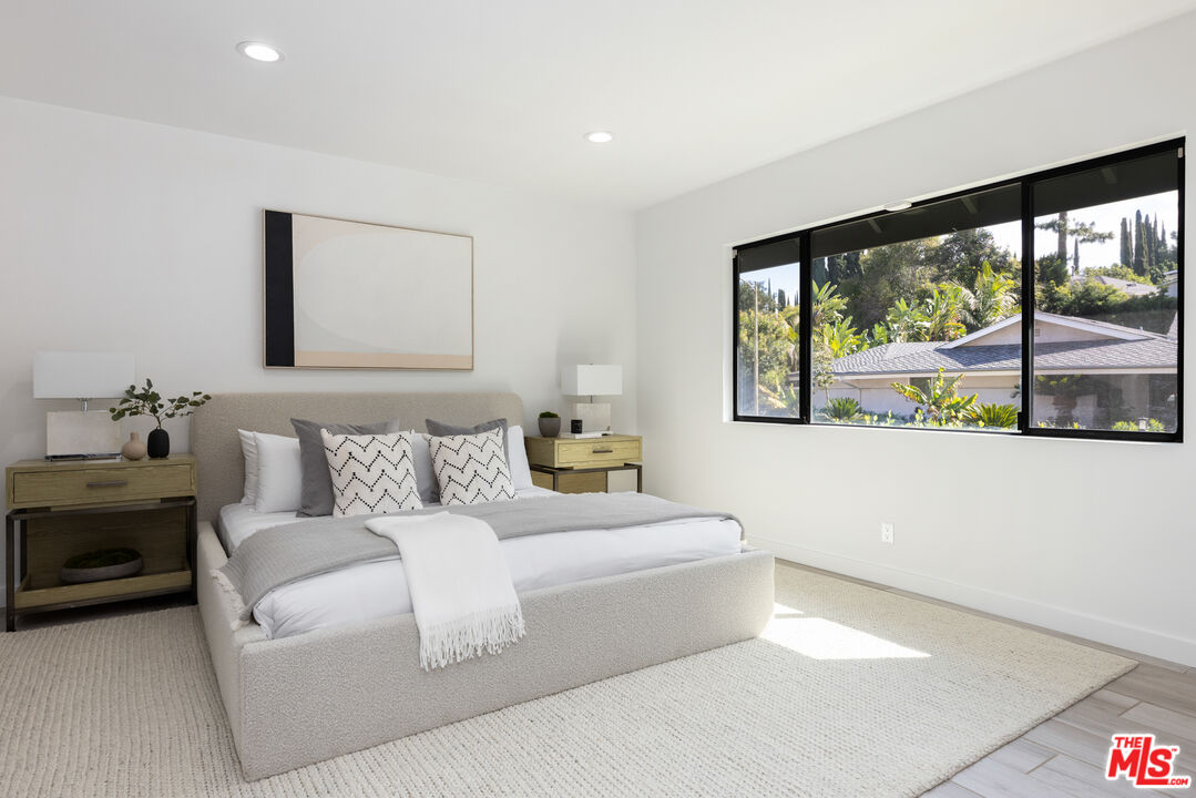 16167 Meadowcrest Road Sherman Oaks, CA 91403 - Photo 16 of 31 a living room with furniture and a large window
