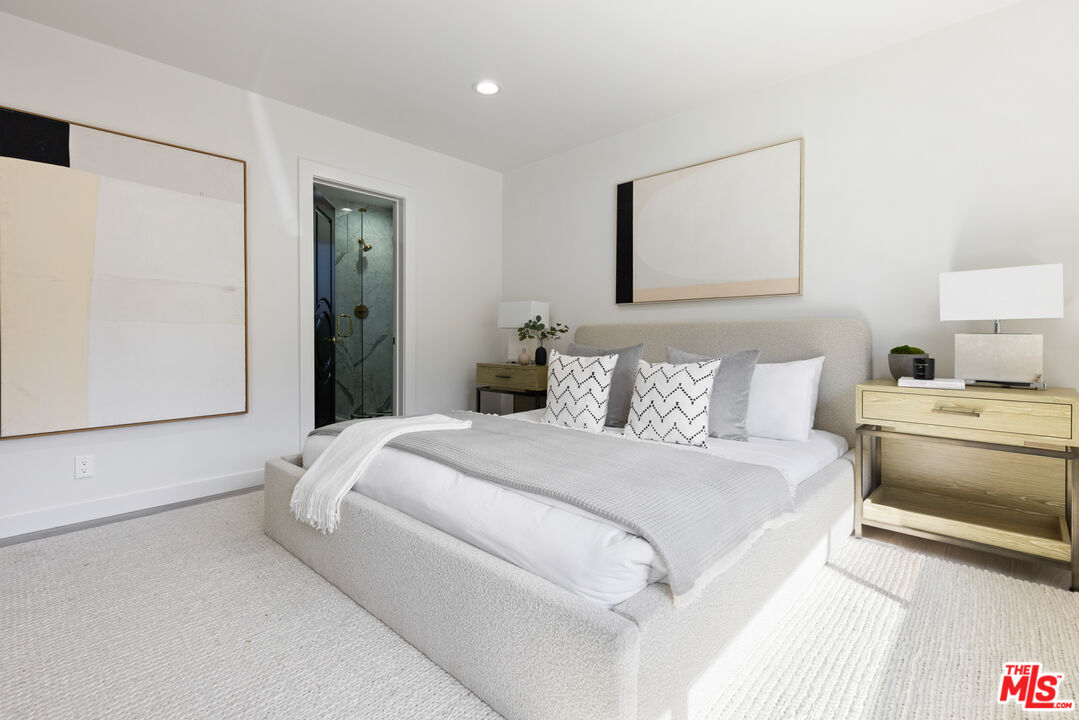 16167 Meadowcrest Road Sherman Oaks, CA 91403 - Photo 17 of 31 a bedroom with a bed and a couch