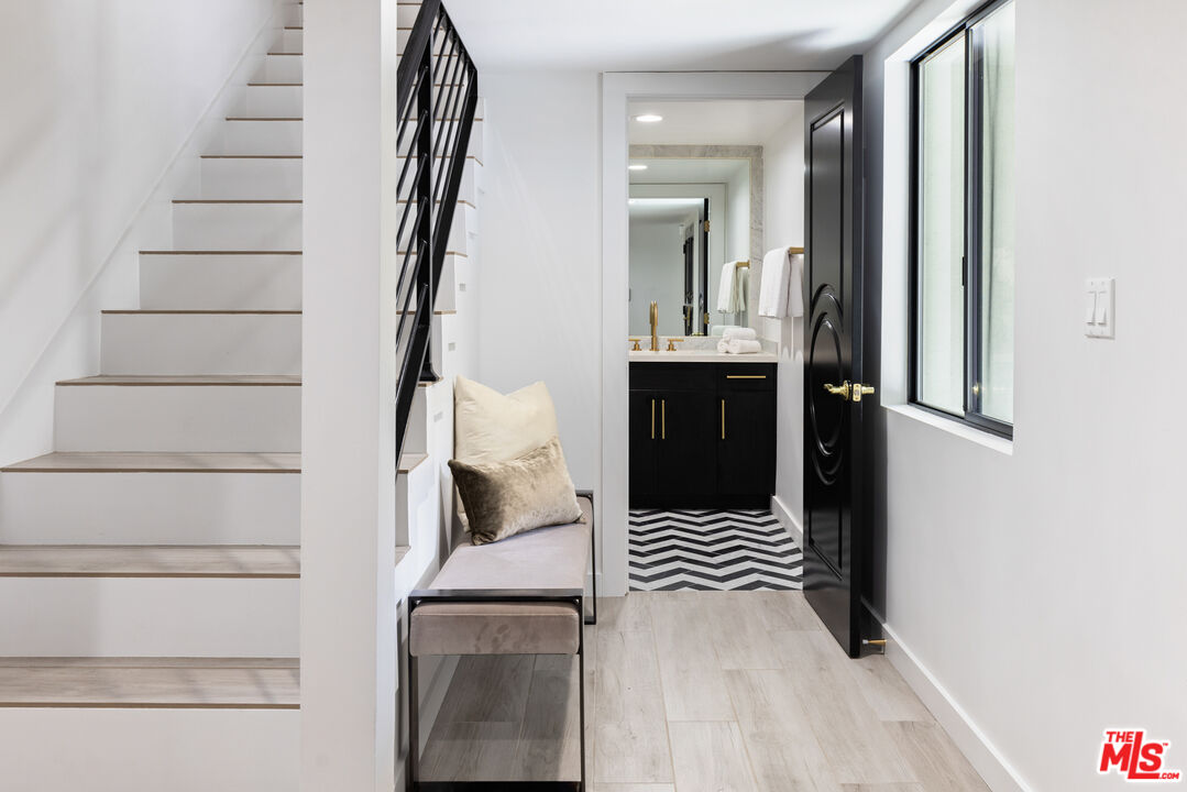 16167 Meadowcrest Road Sherman Oaks, CA 91403 - Photo 2 of 31 a view of an entryway with wooden floor and staircase