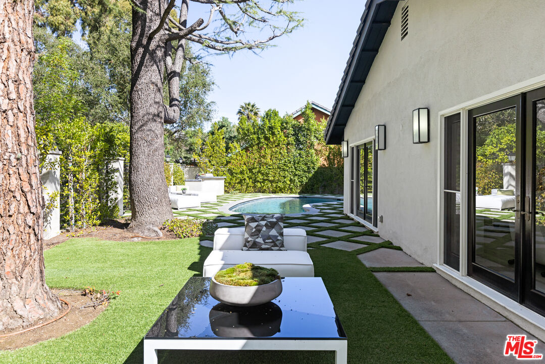16167 Meadowcrest Road Sherman Oaks, CA 91403 - Photo 31 of 31 a view of a porch with furniture and yard