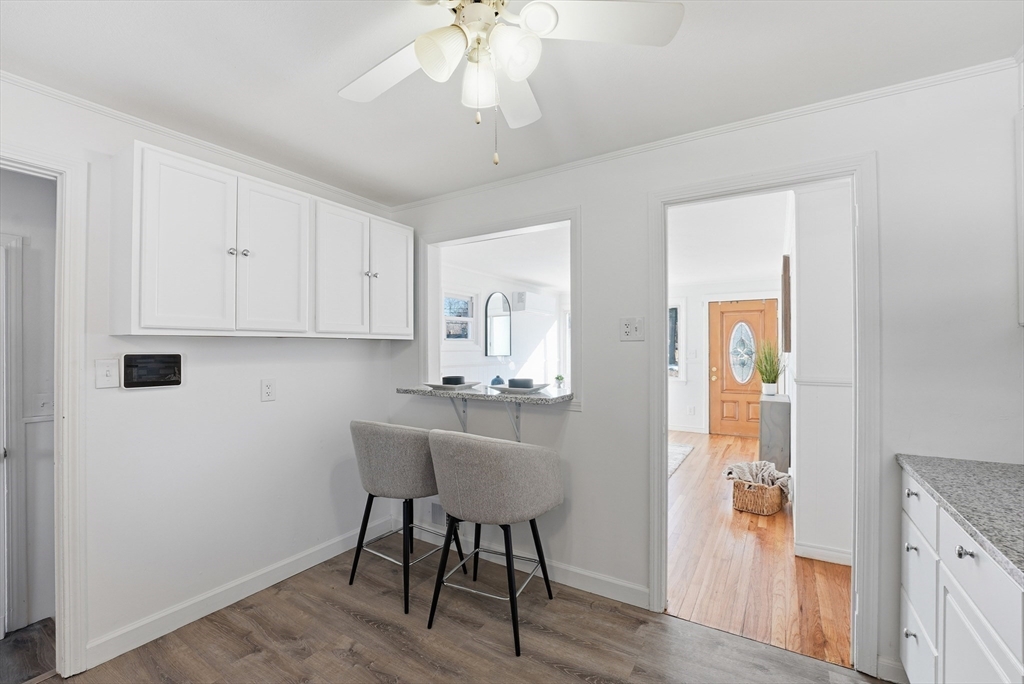 744 Bradley Road Springfield, MA 01109 - Photo 11 of 41 a view of a dining room with furniture and wooden floor