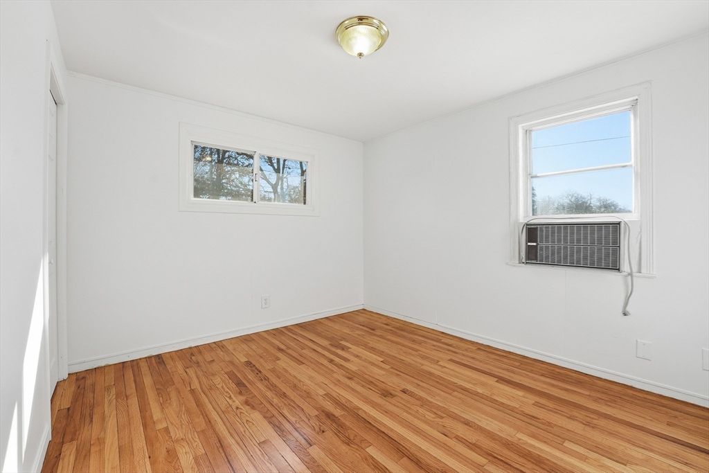 744 Bradley Road Springfield, MA 01109 - Photo 15 of 41 a view of empty room with wooden floor