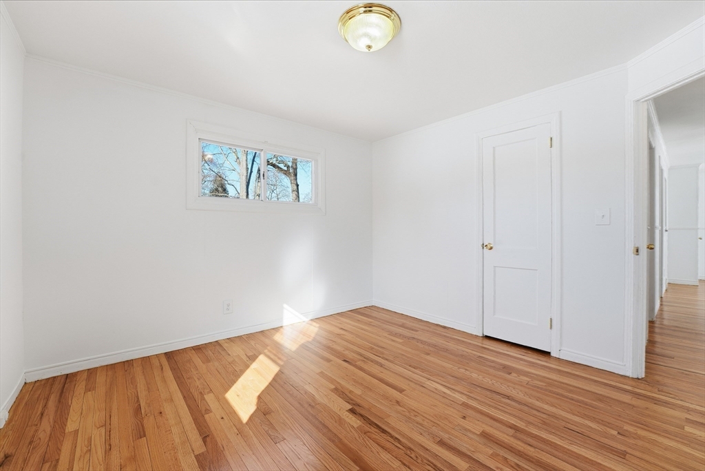 744 Bradley Road Springfield, MA 01109 - Photo 21 of 41 a view of a room with wooden floor