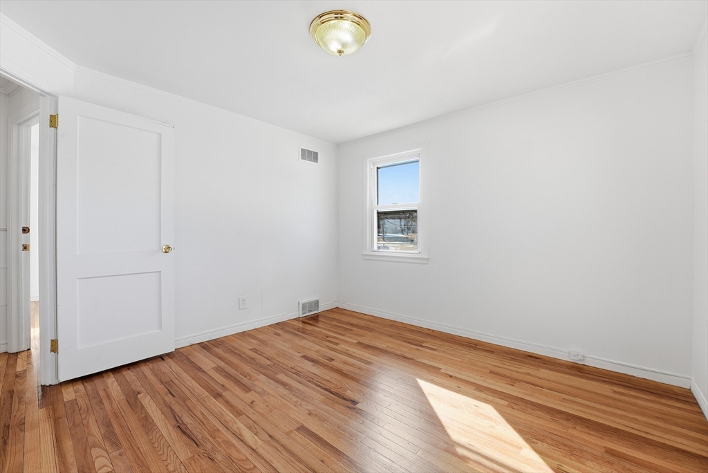 744 Bradley Road Springfield, MA 01109 - Photo 22 of 41 a view of empty room with wooden floor