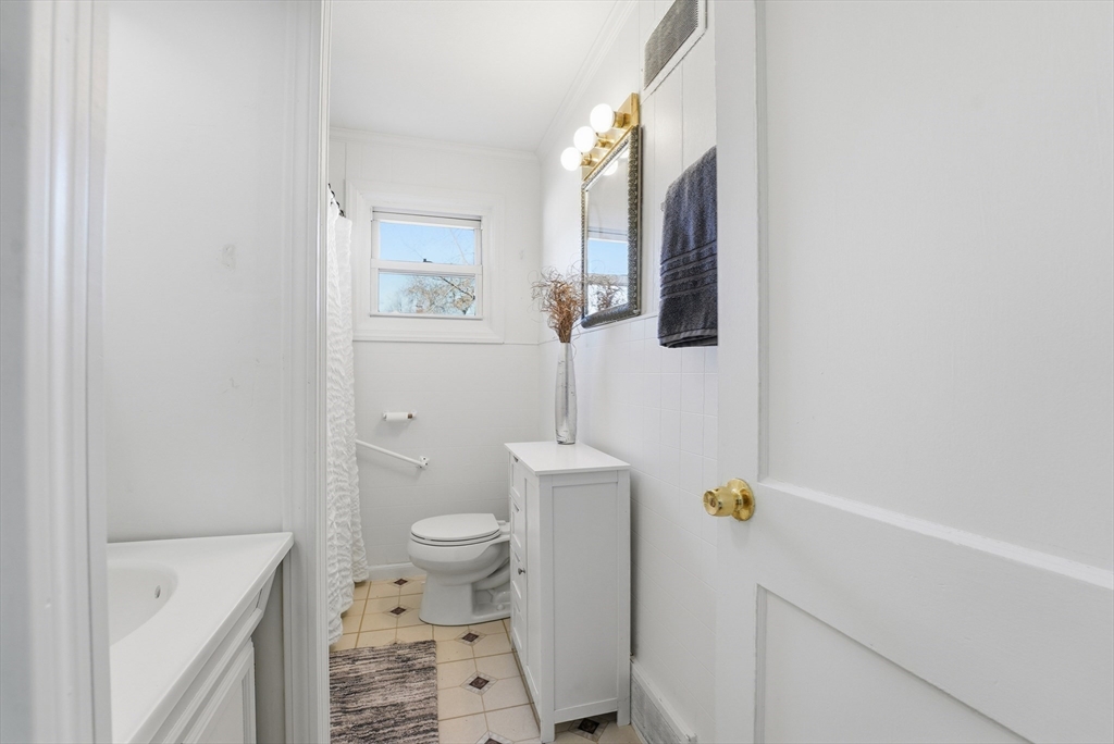 744 Bradley Road Springfield, MA 01109 - Photo 25 of 41 a bathroom with a sink a toilet and shower