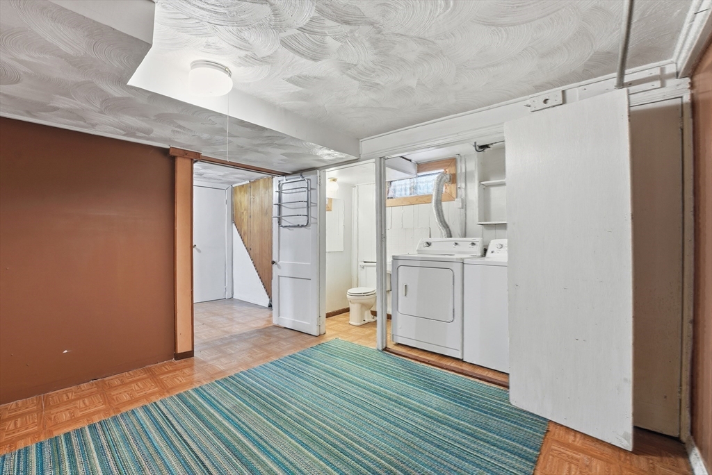 744 Bradley Road Springfield, MA 01109 - Photo 32 of 41 a view of a hallway with wooden floor and stairs