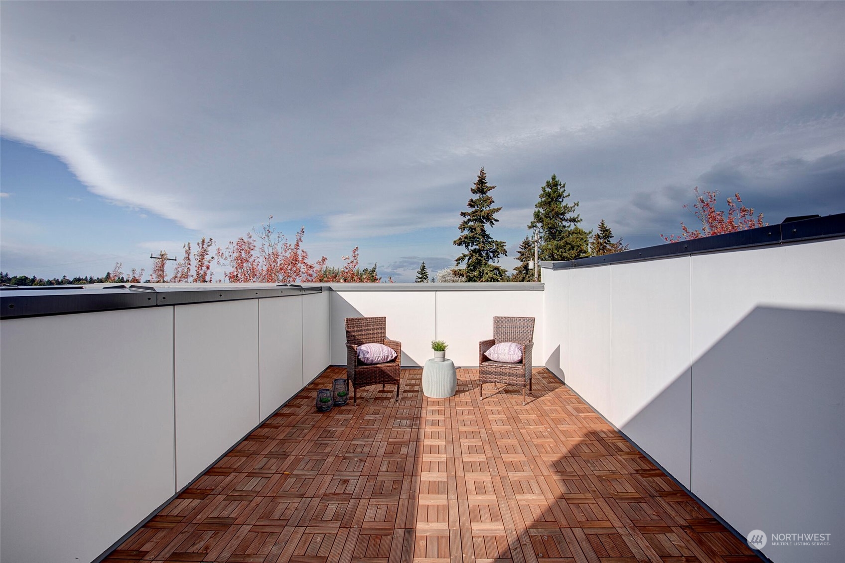 10170 Holman Road Northwest, Unit G Seattle, WA 98133 - Photo 17 of 23 a living room with furniture and a potted plant