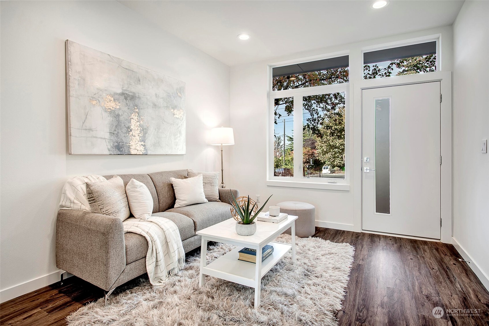 10170 Holman Road Northwest, Unit G Seattle, WA 98133 - Photo 2 of 23 a living room with furniture and a window