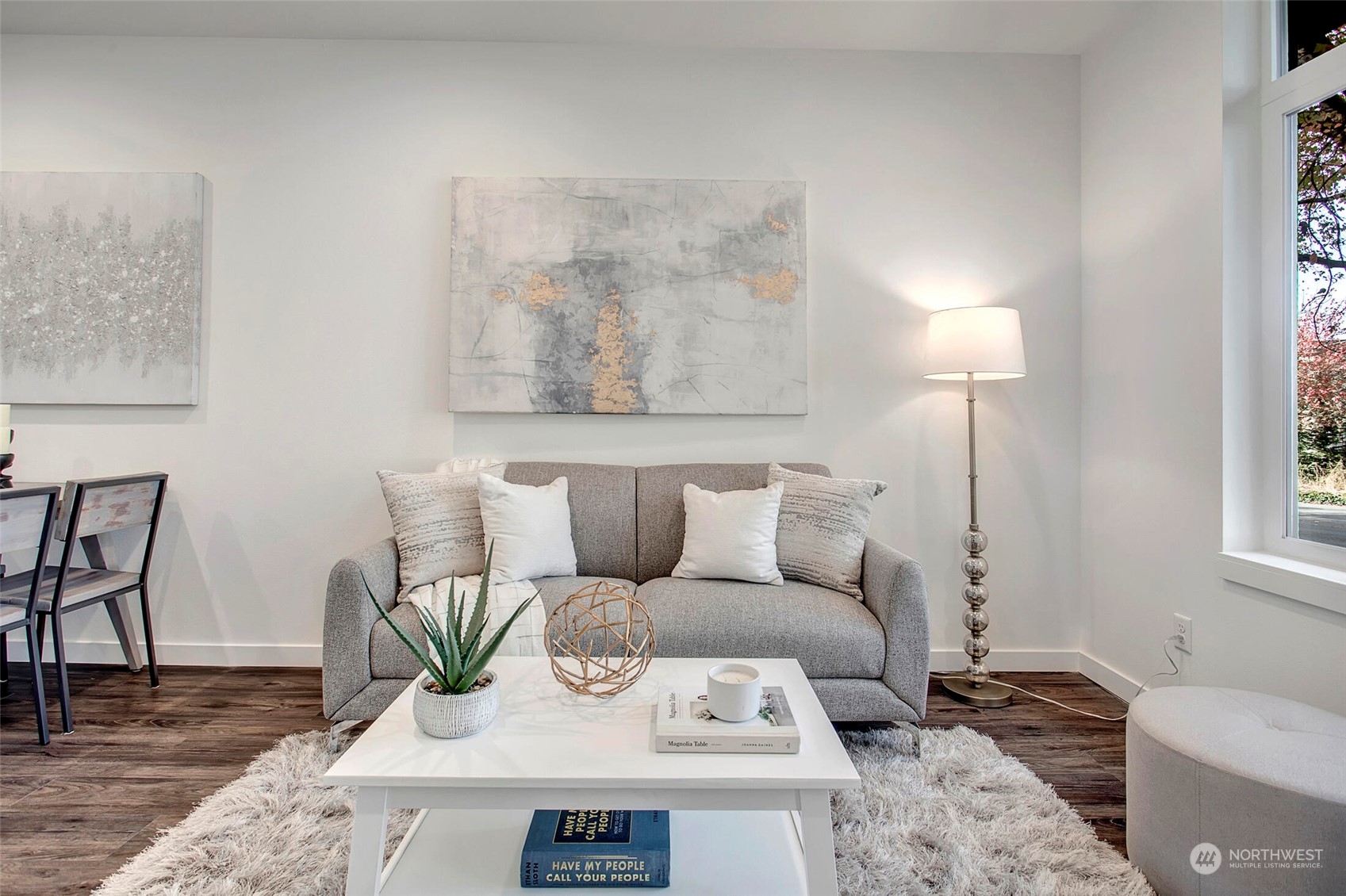 10170 Holman Road Northwest, Unit G Seattle, WA 98133 - Photo 5 of 23 a living room with furniture and a couch