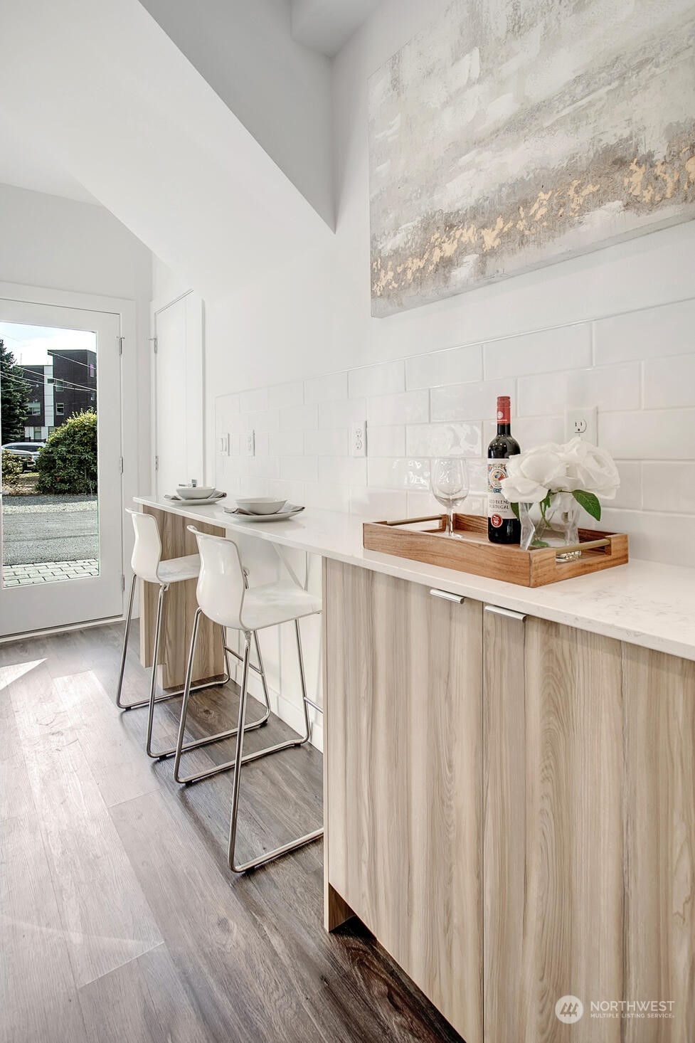 10170 Holman Road Northwest, Unit G Seattle, WA 98133 - Photo 8 of 23 a living room with furniture a flat screen tv and a table