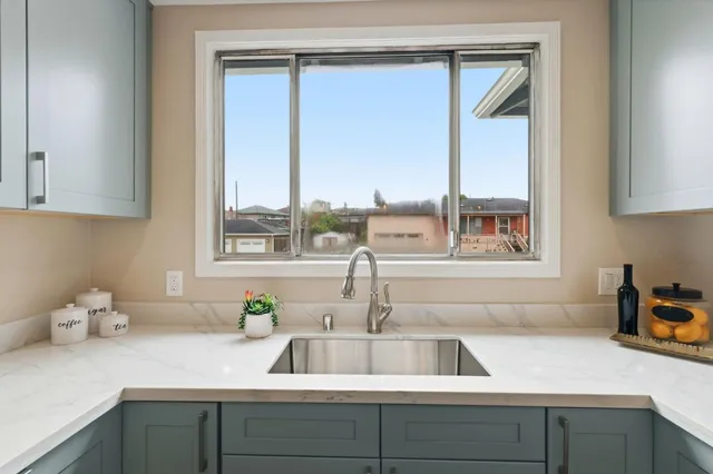 a kitchen with a sink and a window