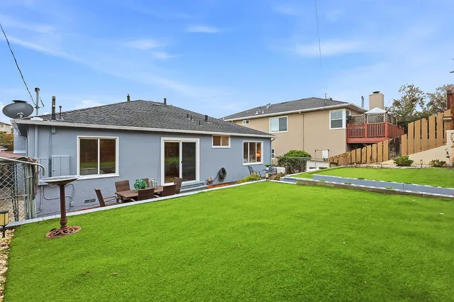 a front view of a house with a yard and porch