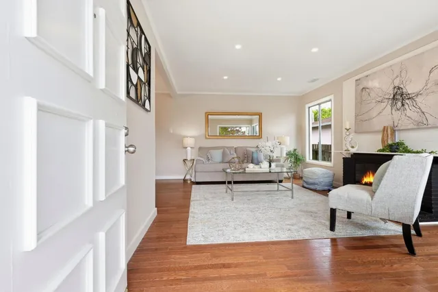 a living room with furniture and a table