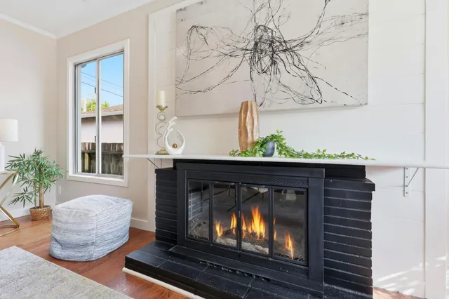 a living room with furniture and a fireplace