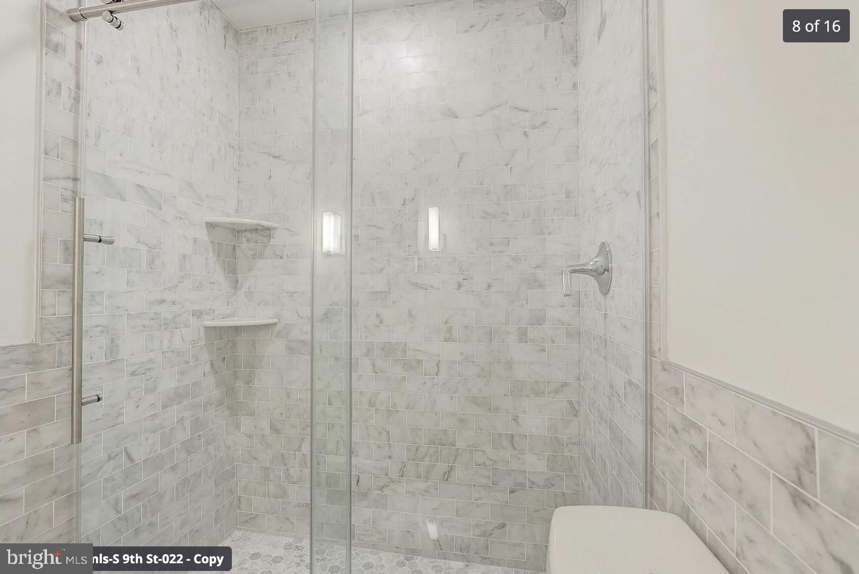 261-269 South 9th Street, Unit 504 Philadelphia, PA 19107 - Photo 16 of 27 a bathroom with a shower