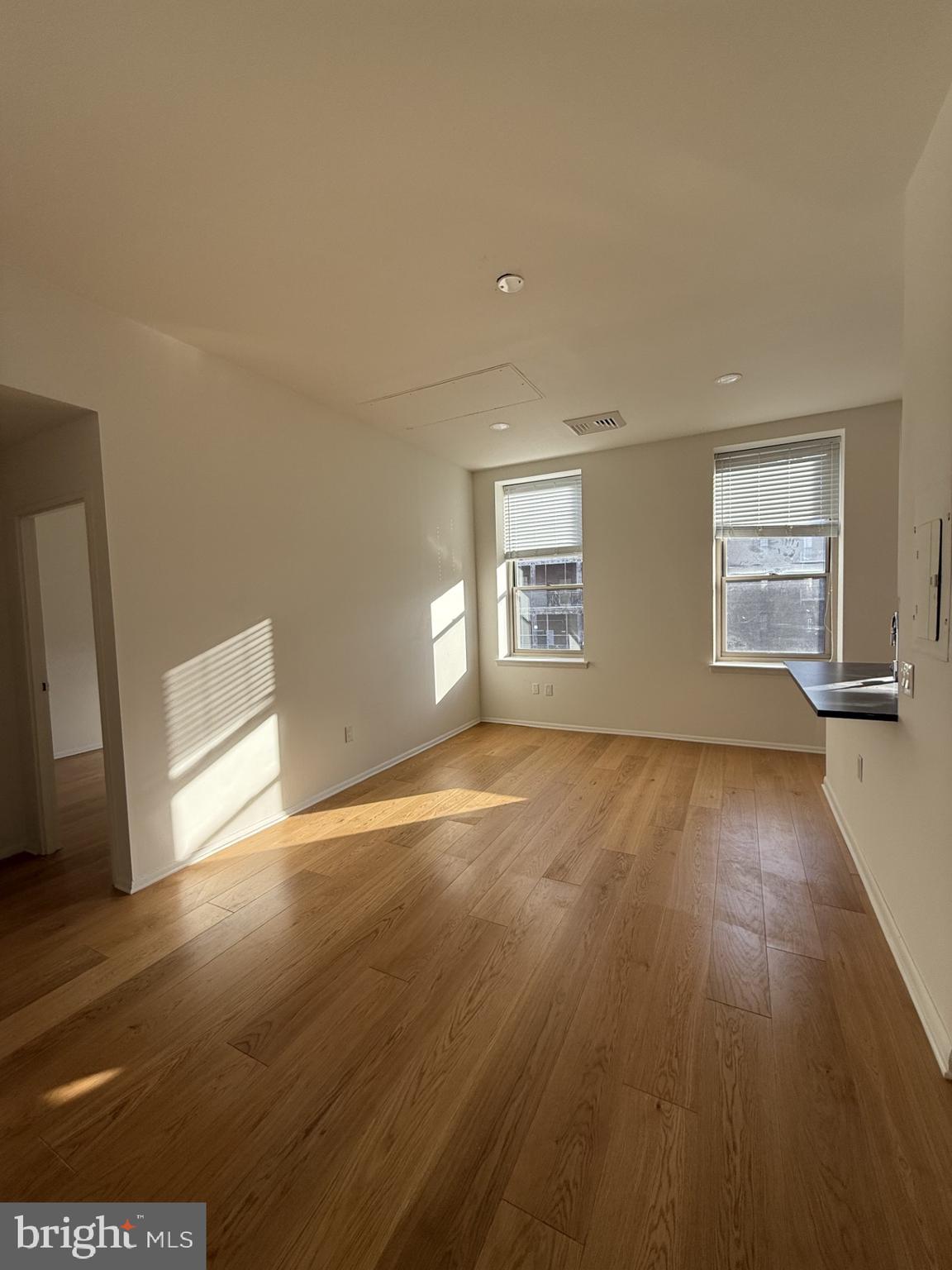 261-269 South 9th Street, Unit 504 Philadelphia, PA 19107 - Photo 17 of 27 a view of empty room with wooden floor and fan