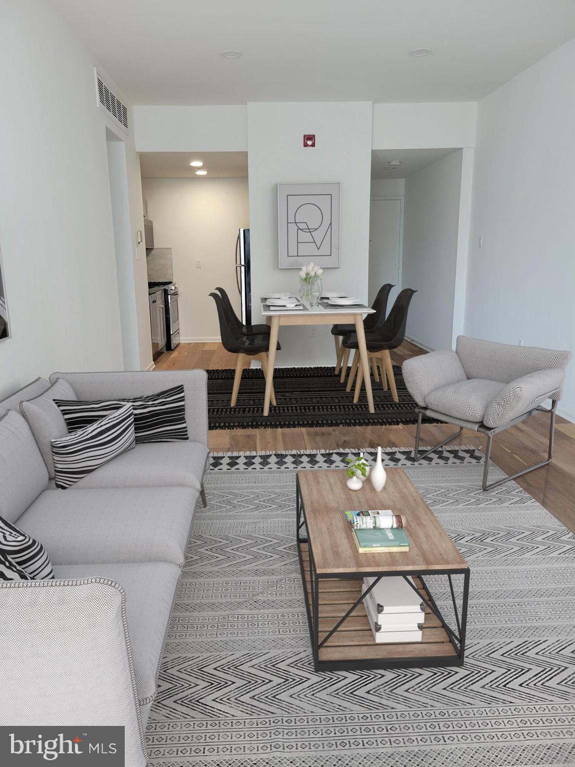 261-269 South 9th Street, Unit 504 Philadelphia, PA 19107 - Photo 8 of 27 a living room with furniture