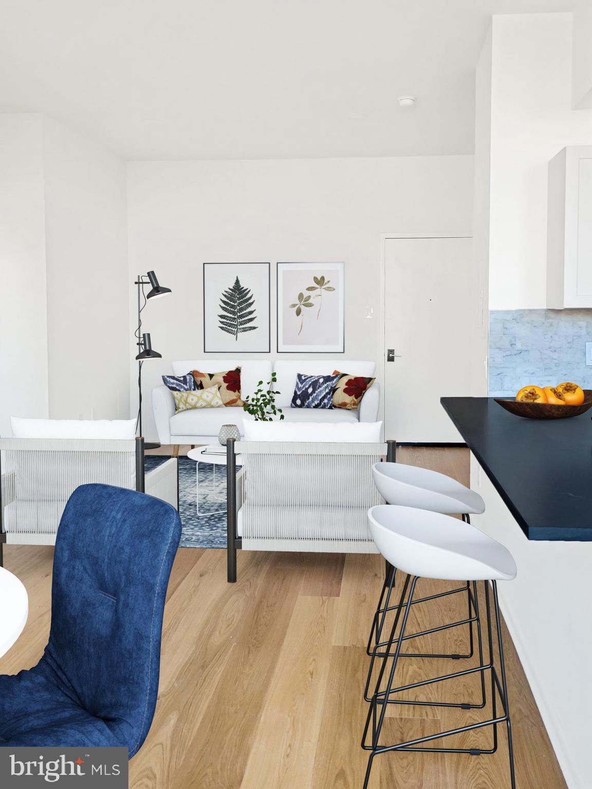 261-269 South 9th Street, Unit 504 Philadelphia, PA 19107 - Photo 10 of 27 a living room with furniture and a table