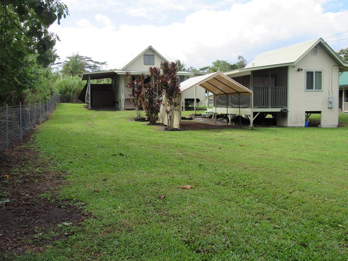 a front view of house with yard and seating area