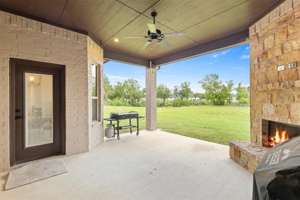 105 Clayton Crossing Springtown, TX 76082 - Photo 29 of 40 a view of a porch with furniture and garden