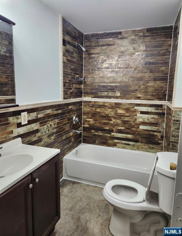 93 Astor Street, Unit 2 Newark, NJ 07114 - Photo 2 of 5 a bathroom with a sink toilet and shower