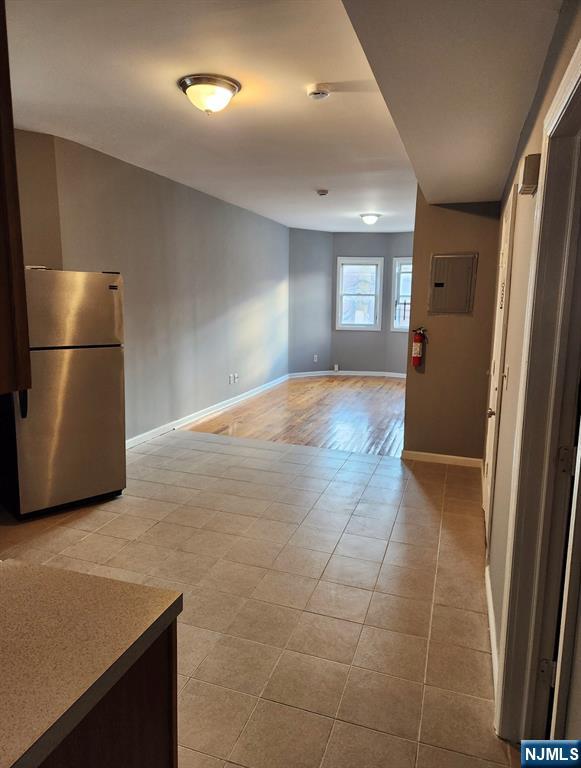93 Astor Street, Unit 2 Newark, NJ 07114 - Photo 4 of 5 a view of an empty room and a kitchen