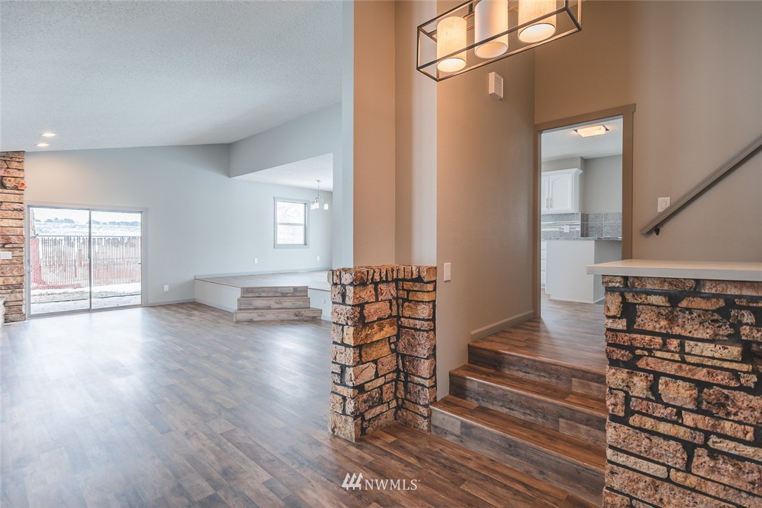 8037 Valley Road Northeast Moses Lake, WA 98837 - Photo 18 of 39 wooden floor in an empty room with a window