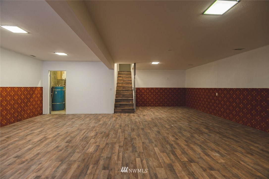 8037 Valley Road Northeast Moses Lake, WA 98837 - Photo 35 of 39 a view of an empty room with wooden floor