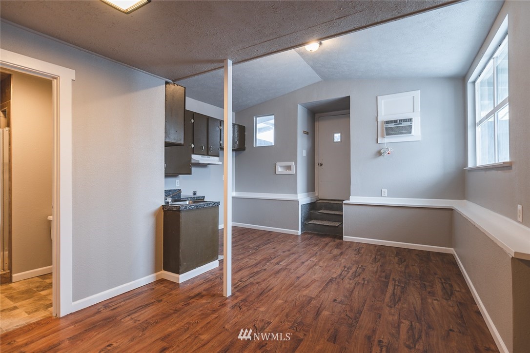 8037 Valley Road Northeast Moses Lake, WA 98837 - Photo 36 of 39 an empty room with wooden floor and a window