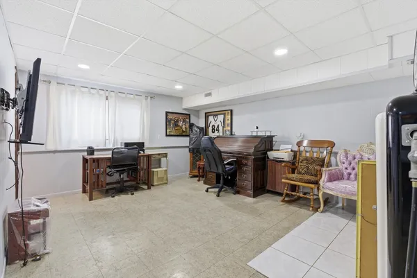 a view of a workspace with furniture