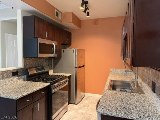 3318 North Decatur Boulevard, Unit 1163 Las Vegas, NV 89130 - Photo 18 of 35 A streamlined kitchen design boasts ample counter space and stainless steel appliances.
