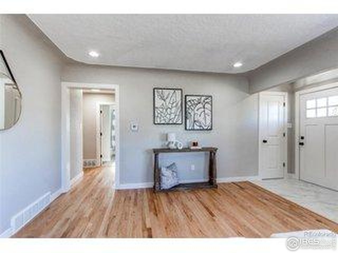 784 South 3rd Avenue Brighton, CO 80601 - Photo 11 of 17 a view of a big room with wooden floor and windows