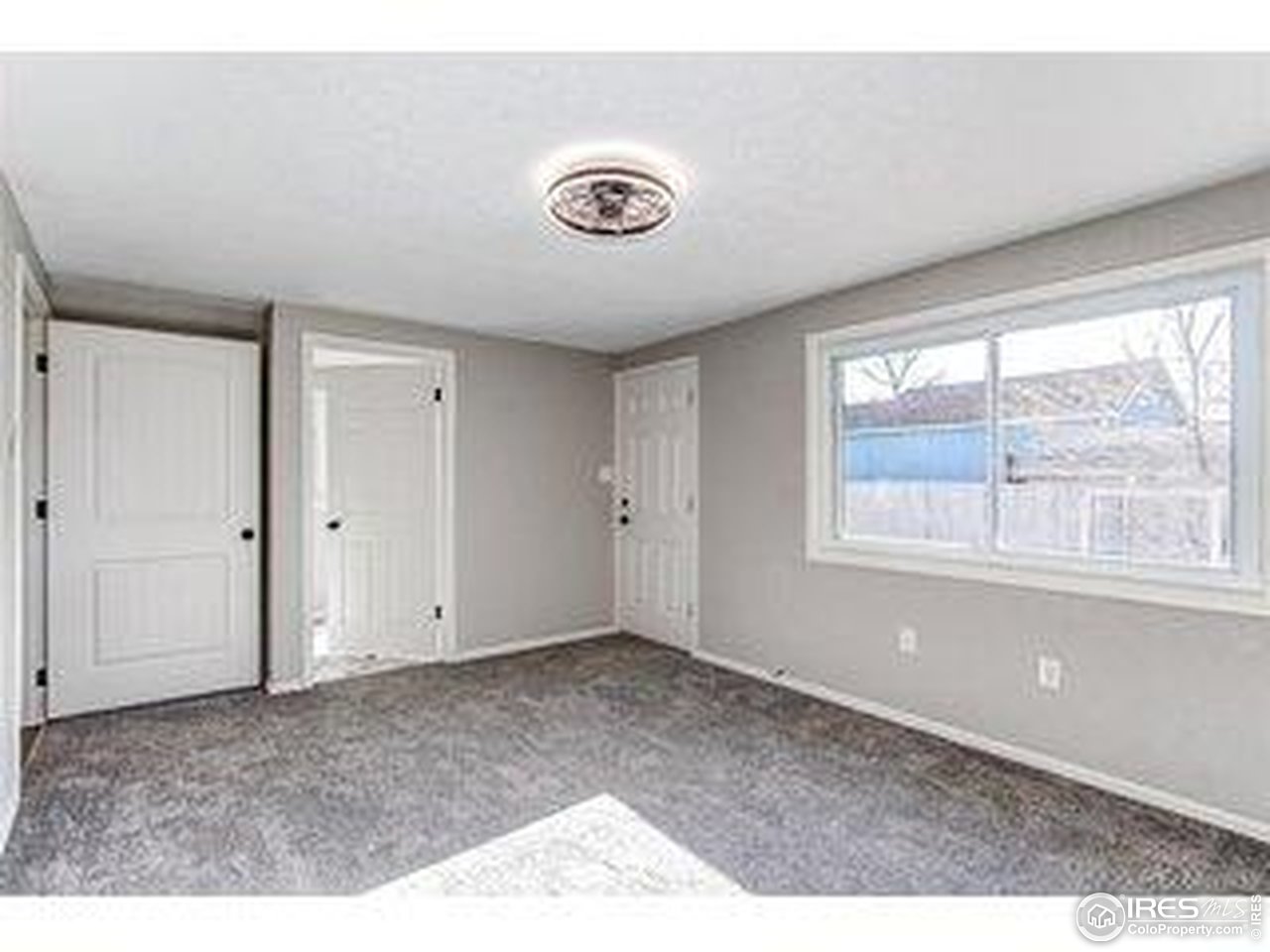 784 South 3rd Avenue Brighton, CO 80601 - Photo 13 of 17 a view of an empty room with a window