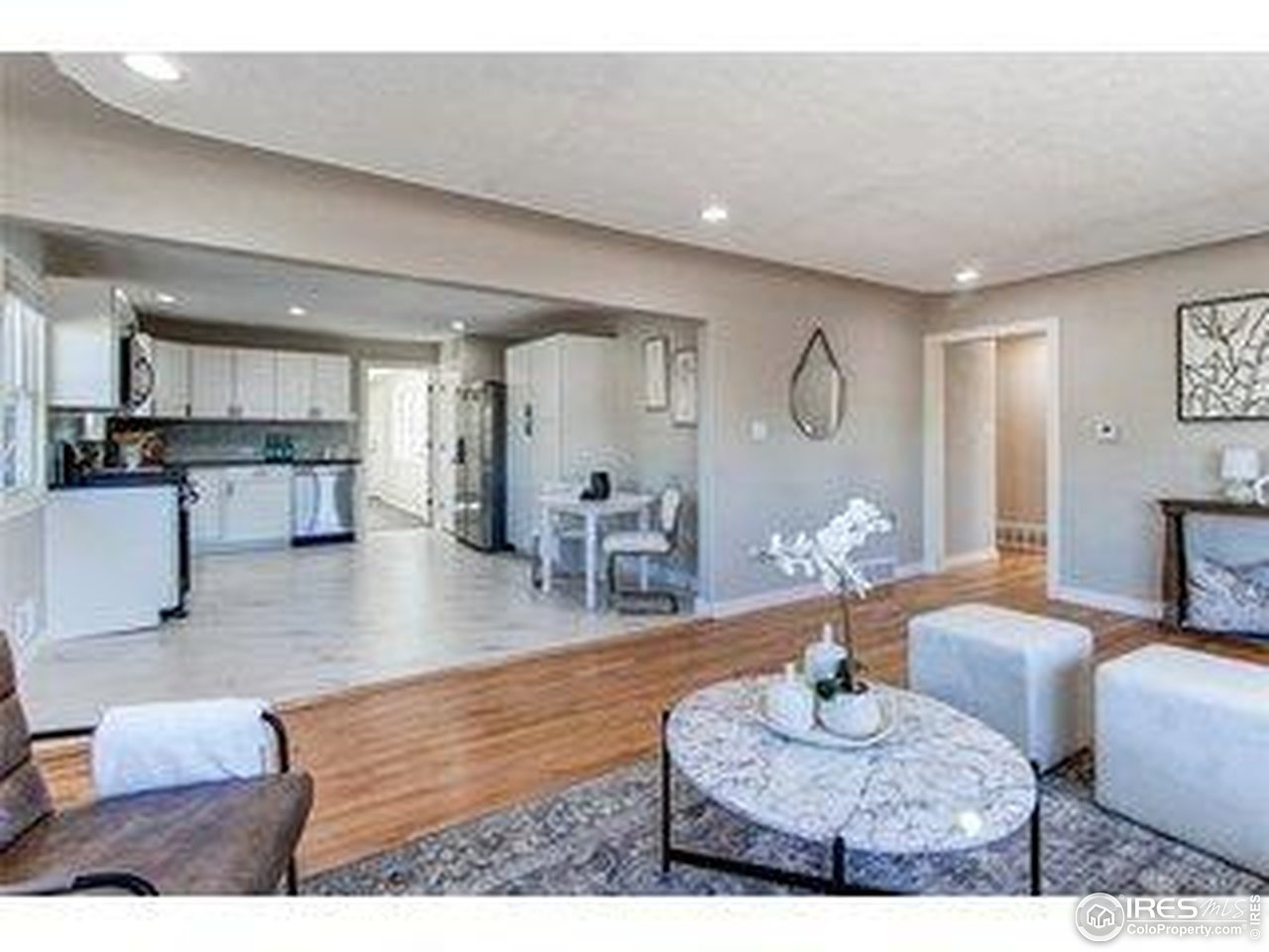 784 South 3rd Avenue Brighton, CO 80601 - Photo 3 of 17 a living room with furniture and wooden floor
