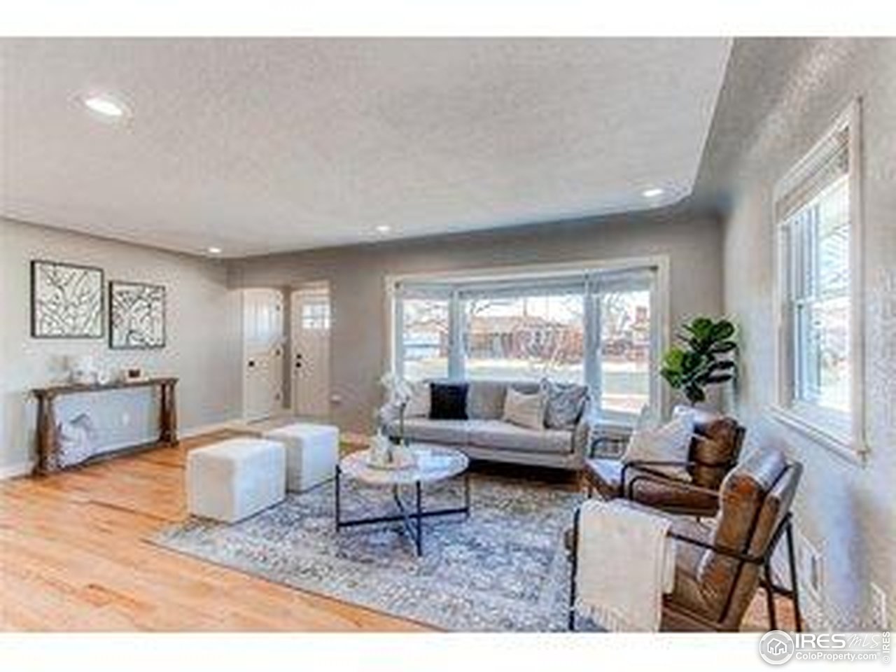 784 South 3rd Avenue Brighton, CO 80601 - Photo 4 of 17 a living room with furniture and a large window