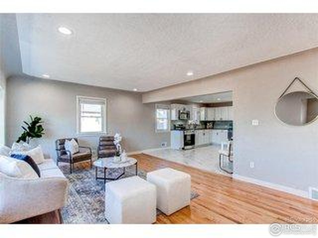 784 South 3rd Avenue Brighton, CO 80601 - Photo 6 of 17 a living room with furniture and a wooden floor