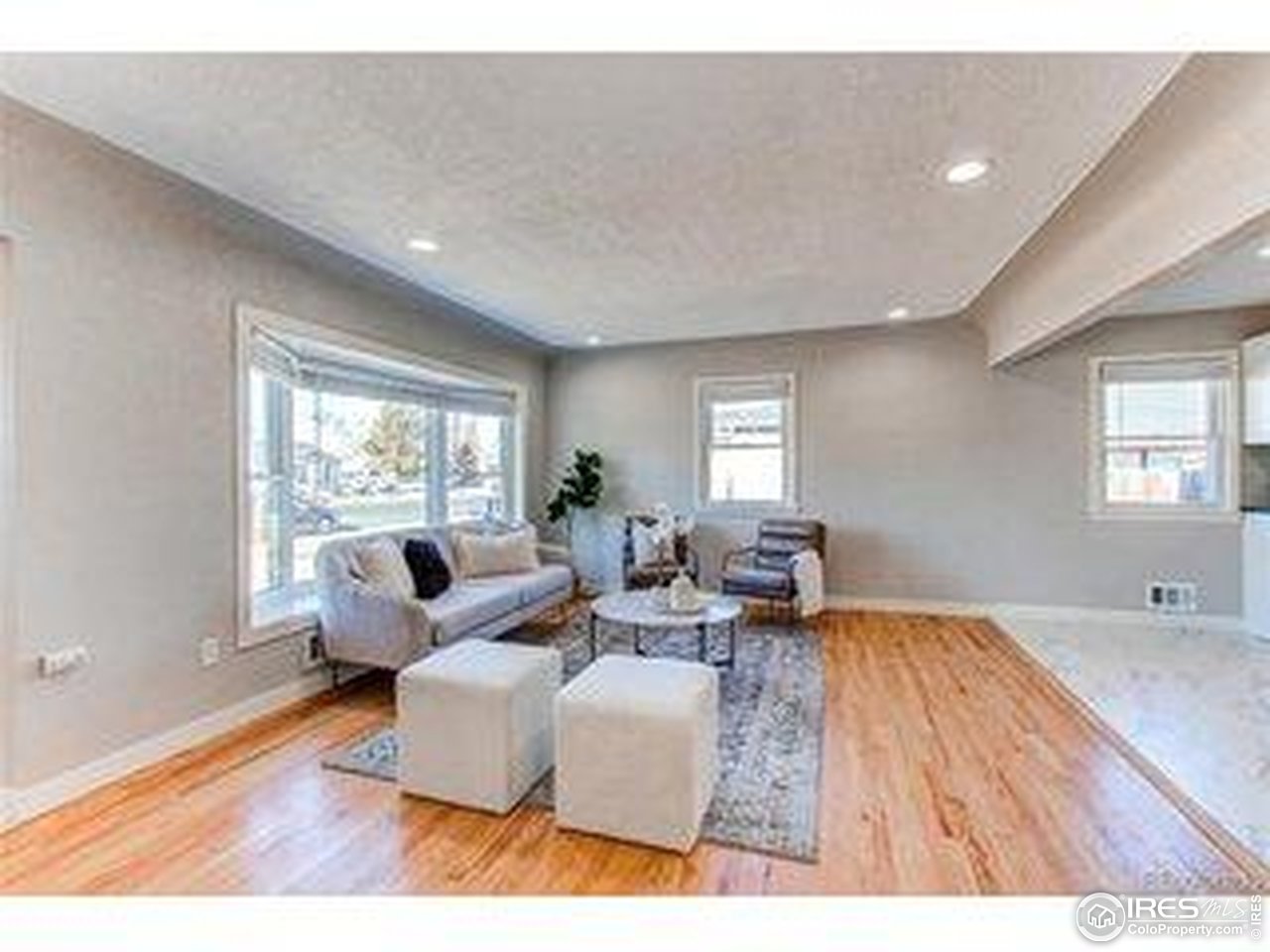 784 South 3rd Avenue Brighton, CO 80601 - Photo 7 of 17 a living room with furniture and a large window