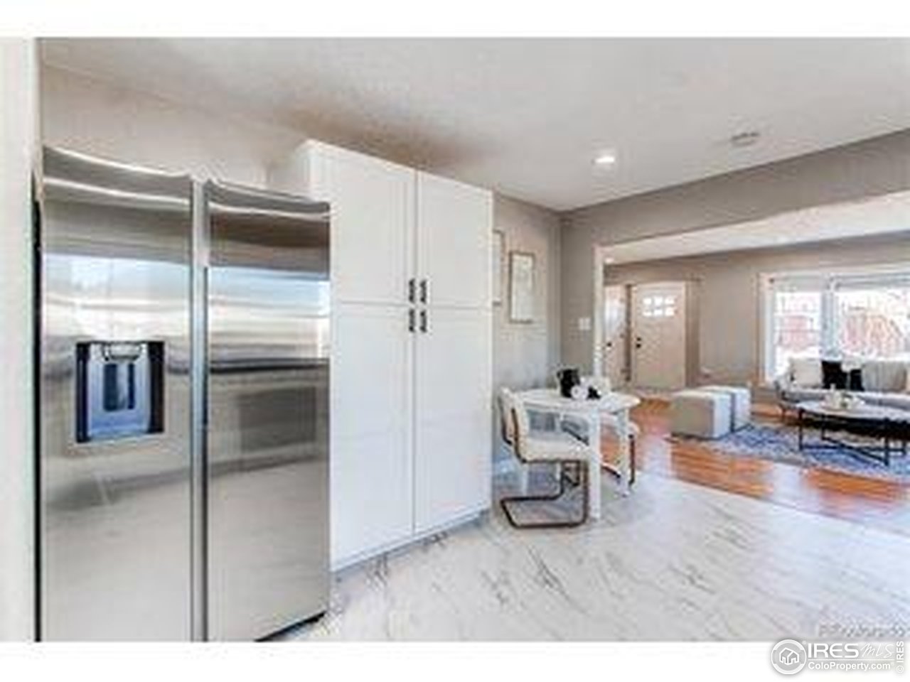784 South 3rd Avenue Brighton, CO 80601 - Photo 10 of 17 a living room with furniture and a table