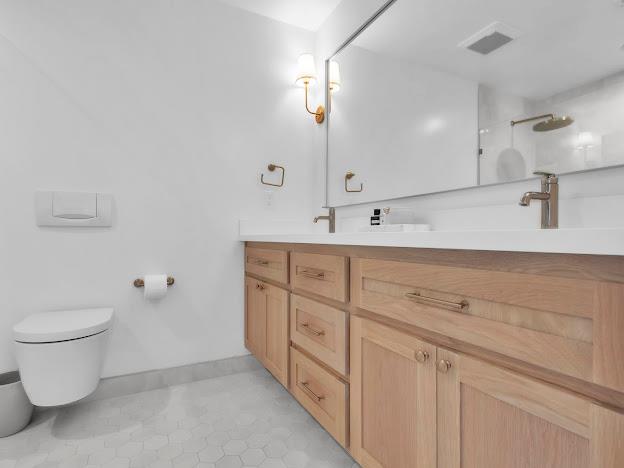 5841 Sharps Circle Carmichael, CA 95608 - Photo 16 of 38 a bathroom with a double vanity sink and a toilet