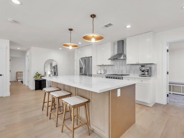 5841 Sharps Circle Carmichael, CA 95608 - Photo 9 of 38 a kitchen with stainless steel appliances a table and chairs in it