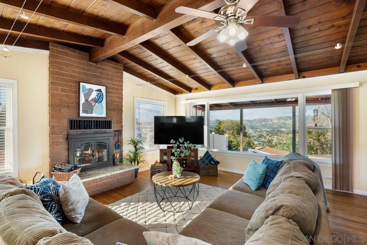 8601 Gardena Road Lakeside, CA 92040 - Photo 1 of 25 a living room with furniture a fireplace and a flat screen tv