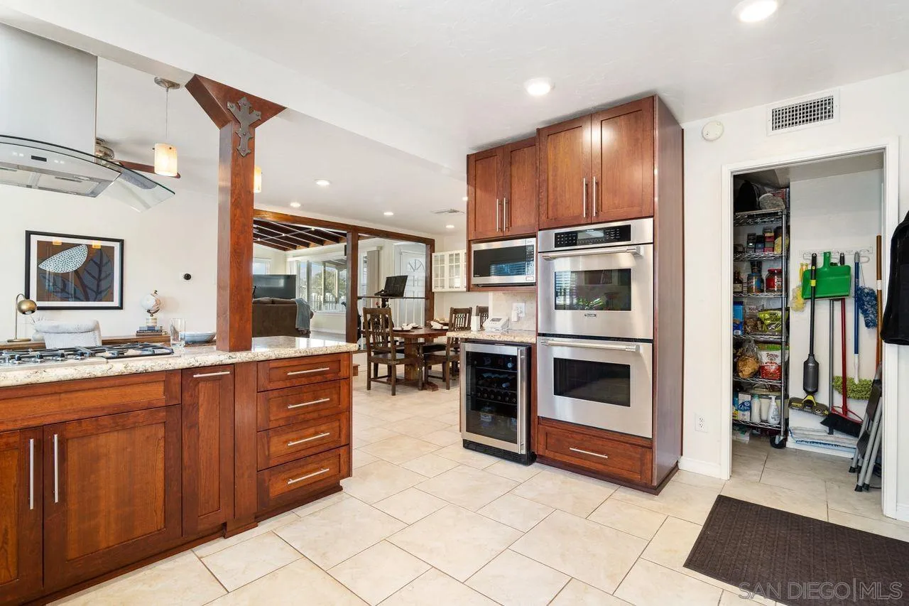 8601 Gardena Road Lakeside, CA 92040 - Photo 11 of 25 a kitchen with stainless steel appliances a stove a sink and a refrigerator