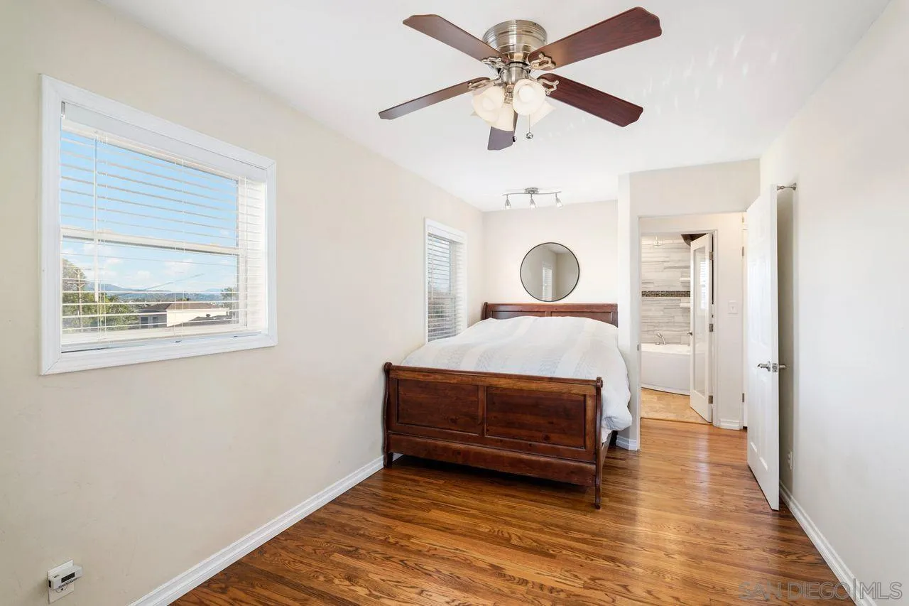 8601 Gardena Road Lakeside, CA 92040 - Photo 16 of 25 a bedroom with a bed and a chandelier