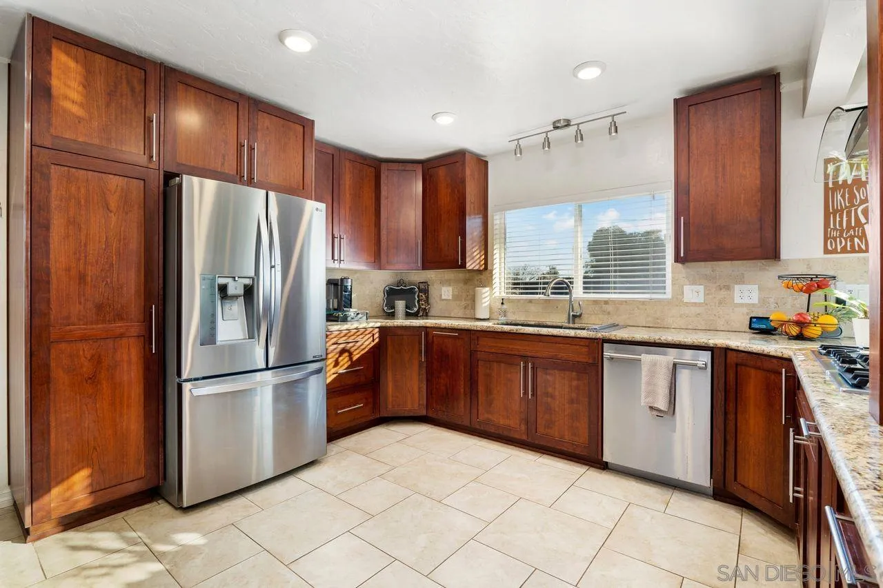 8601 Gardena Road Lakeside, CA 92040 - Photo 9 of 25 a kitchen with granite countertop a refrigerator and a sink