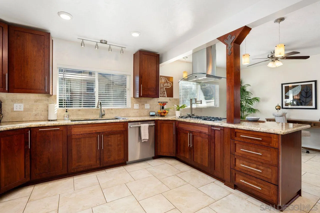 8601 Gardena Road Lakeside, CA 92040 - Photo 10 of 25 a kitchen with stainless steel appliances granite countertop a sink and cabinets