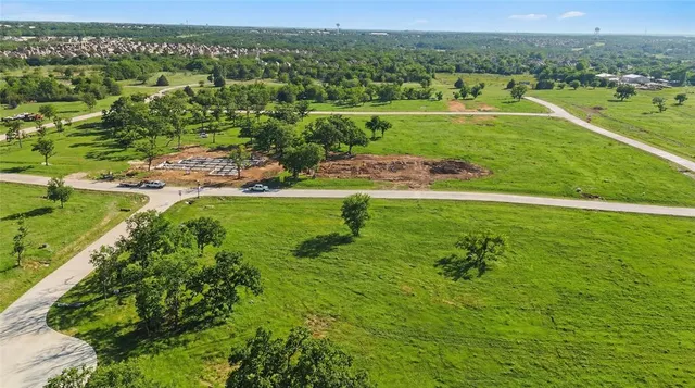 a view of a garden with a building in the background