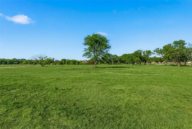 a view of a lake with a big yard