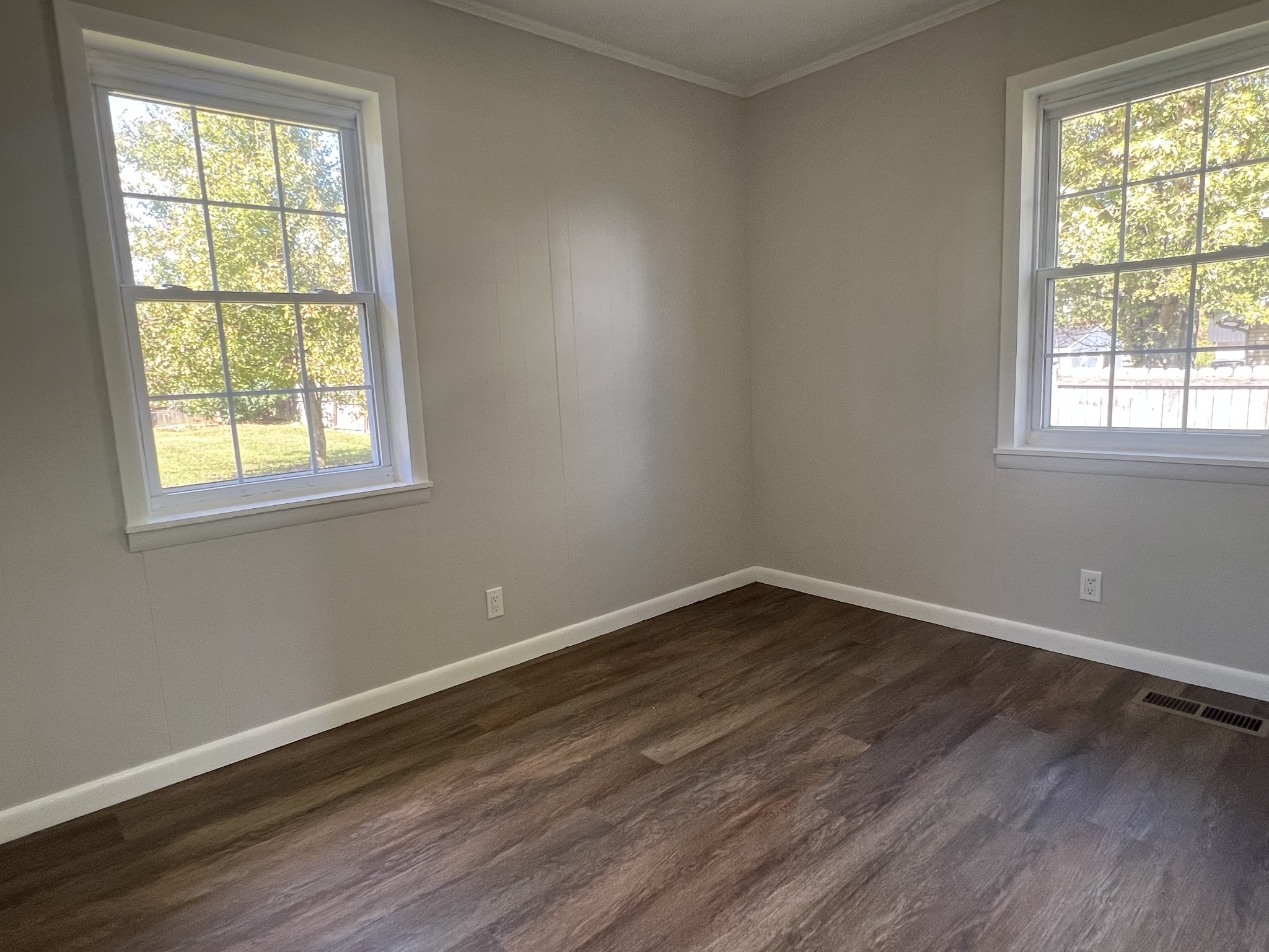 641 Coolidge Road Lafayette, TN 37083 - Photo 11 of 17 an empty room with wooden floor and windows