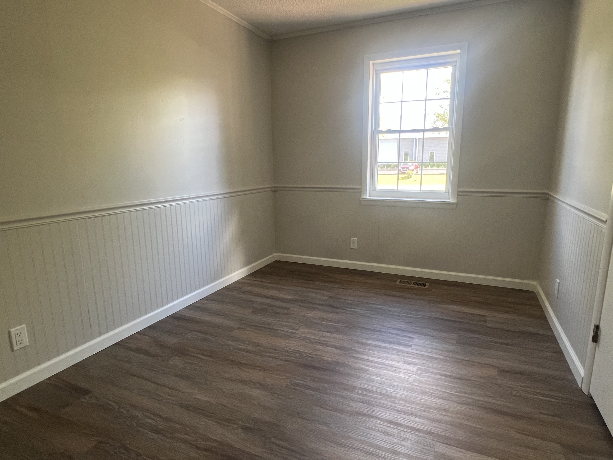 641 Coolidge Road Lafayette, TN 37083 - Photo 13 of 17 an empty room with wooden floor and windows